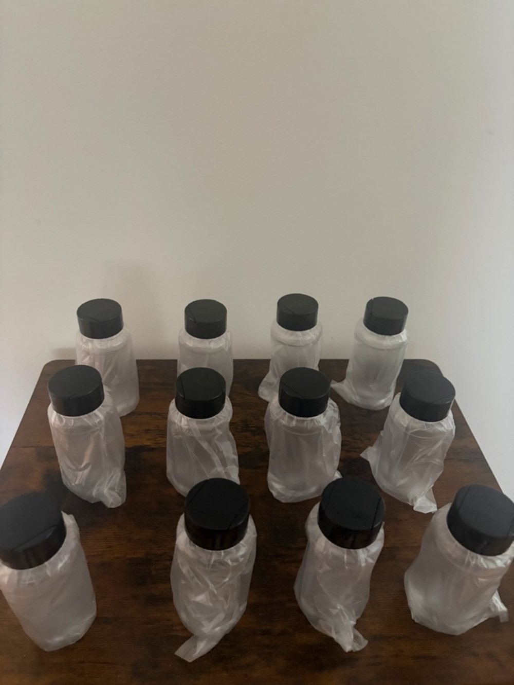 Set of 12 Clear Plastic Bottles with Black Caps